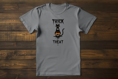 Flat lay of No Candy No Mercy Halloween t-shirt featuring bold minimalist black cat, pumpkin bucket, and Trick or Treat typography