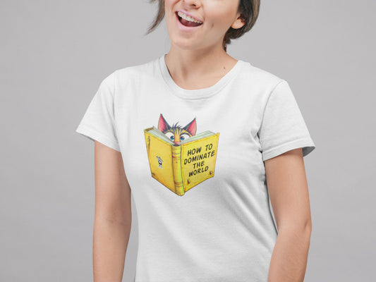 Model wearing How to Dominate the World Funny Conspirator Cat T-Shirt – unisex premium tee with clever cat reading book graphic.