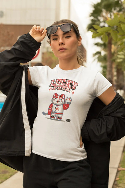 Model wearing Lucky Puck T-Shirt – unisex premium tee with Maneki-neko in hockey gear holding stick, Canadian lucky cat design.