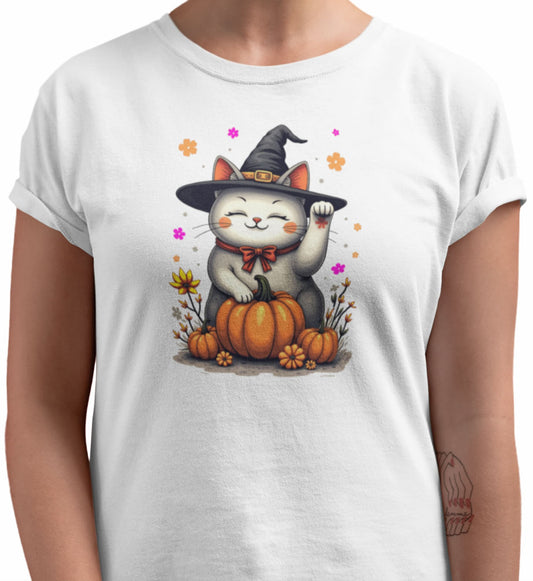 Close-up of Witch Luck cat t-shirt artwork showing witch hat Maneki-neko with raised paw, floral gradients, and playful magical details