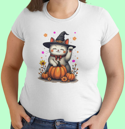 Close-up of Witch Luck cat t-shirt artwork showing witch hat Maneki-neko with raised paw, floral gradients, and playful magical details