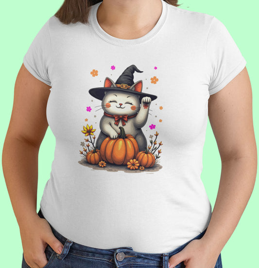 Close-up of Witch Luck cat t-shirt artwork showing witch hat Maneki-neko with raised paw, floral gradients, and playful magical details