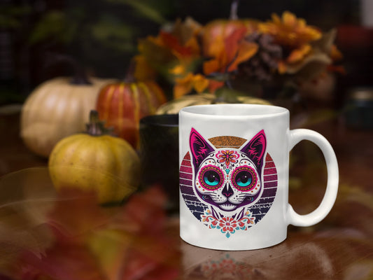 11oz ceramic mug featuring Cat of Los Muertos design – vibrant Día de los Muertos-inspired colors, part of Felinamia’s Meowlloween collection