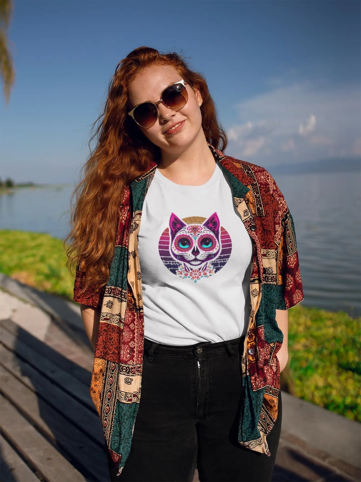 Model wearing Cat of Los Muertos T-Shirt – classic women’s tee with vibrant Día de los Muertos cat design.