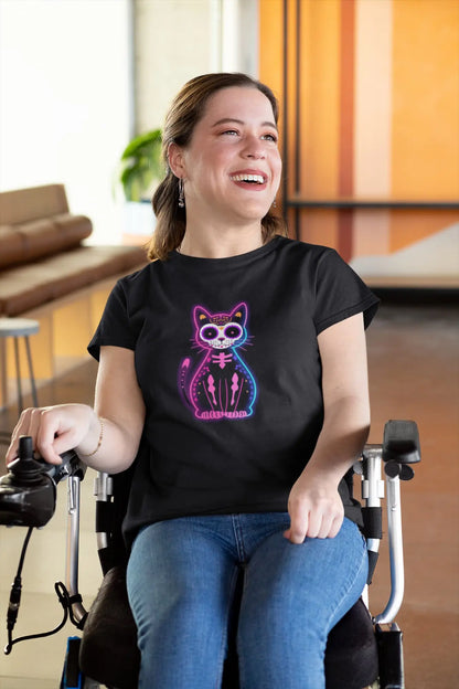 Woman styling Muertos Neon T-Shirt – colorful Día de los Muertos cat design with retro neon aesthetic.