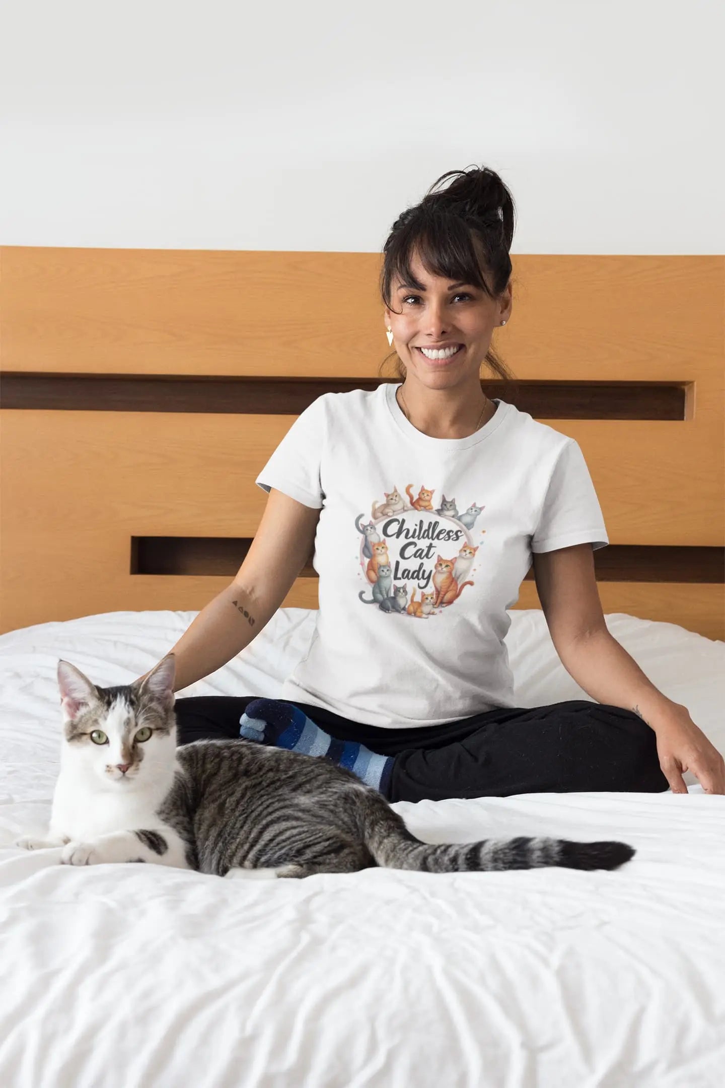 Model wearing Childless Cat Lady II women’s t-shirt with updated feline artwork and bold cat lover text