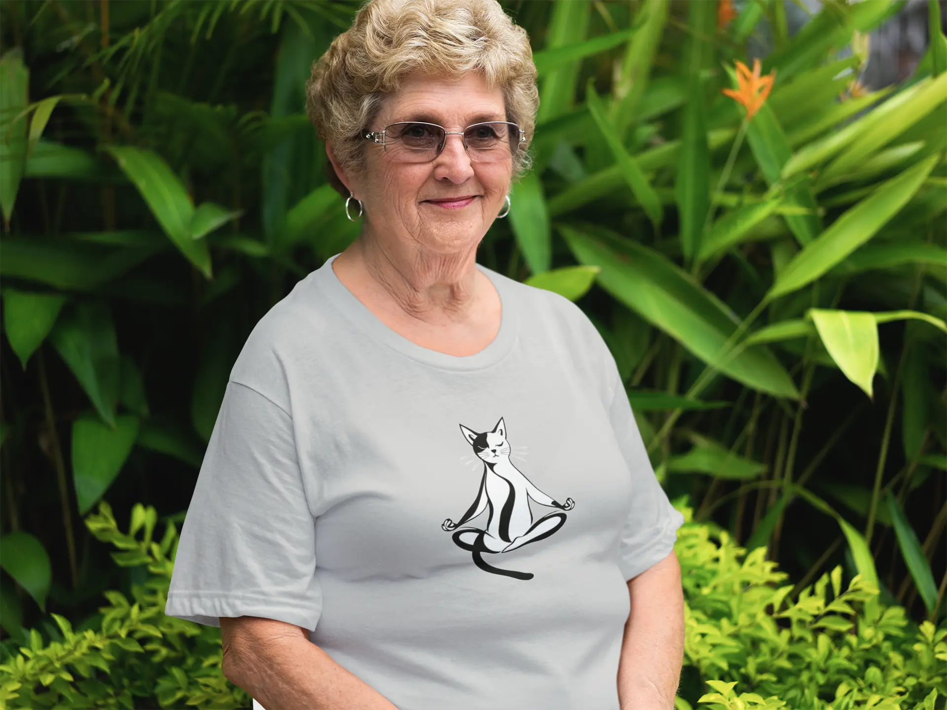 Model wearing Padmasana Yoga Cat t-shirt with minimalist yoga cat design in lotus position